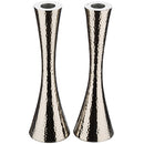 Pair of tall hammered aluminum candle holders with a sleek hourglass design and polished silver finish.