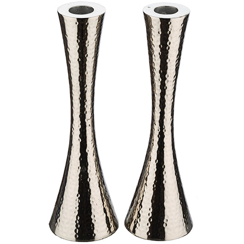Pair of tall hammered aluminum candle holders with a sleek hourglass design and polished silver finish.