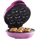 Pink Courant donut maker with lid open showing seven mini donuts inside