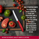 Victorinox multipurpose serrated kitchen knife cutting tomatoes and vegetables on dark background