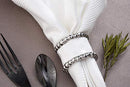 Close-up of napkin ring detail with beaded edge and polished finish