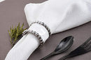 Close-up of napkin ring detail with beaded edge and polished finish