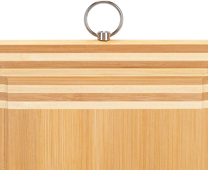 Medium rectangular bamboo cutting board with drip edge on a white background.