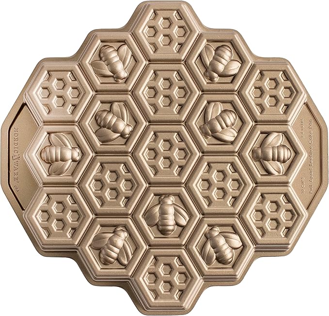 Nordic Ware toffee-colored honeycomb pull-apart Bundt pan with hexagonal cake molds on a white background.
