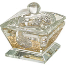 Clear crystal salt holder with gold laser-cut plaque detail and faceted lid