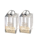Clear crystal salt shaker set with gold-toned base and metal plate