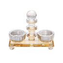 Crystal salt and pepper holder set with gold-accented center handle on rectangular base
