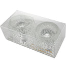 Close up side view of glass candlesticlks sitting in their packaging