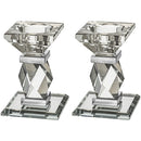 Pair of clear crystal candlesticks on a white background