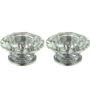 Pair of silver colored crystal candlesticks on a white background 