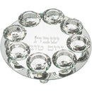 Set of eight crystal candlesticks on a tray that says 'shabbat ve'yomtov in hebrew
