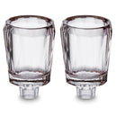 Pair of clear crystal oil cups on a white background