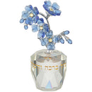 Decorative tree of blessings with a clear crystal base and blue crystal flowers on a white background