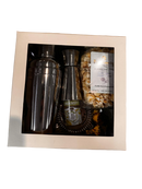 Shalach Manos package with bartools inside in a white cardboard box with a clear plastic top in a white background