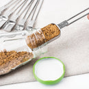 Measuring spoon taking brown sugar out of a narrow bottle opening