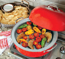 A round, red metal stovetop smoker with a high-domed lid, a built-in thermometer, and silver side handles.