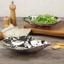  A medium-sized Pampa Bay oyster bowl made of white porcelain with a textured, organic shape.