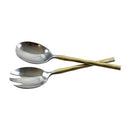 A set of two stainless steel salad servers, with gold-colored wave handles and polished silver heads, crossed on a white background.