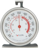 Taylor large dial oven thermometer with stainless steel body and 3.25-inch face, standing on a white background.