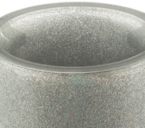 Close up of the acrylic wash cup's silver glittered rim, shown on a white background