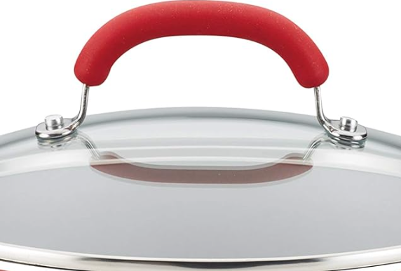 Close up of the red stainless steel-silicone lid handles, displayed on a white background.