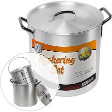 A large aluminum koshering pot set, including a perforated strainer insert and a matching lid. The pot has sturdy black handles and is labeled for koshering use, making it ideal for Passover or general kosher kitchen preparation.