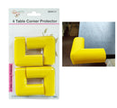 A set of four bright yellow, thick, foam-like safety corner protectors in L-shape, shown in retail packaging and a close-up applied to a dark table corner.