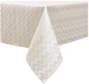 Rectangular gold jacquard zigzag tablecloth laid flat on a white background.