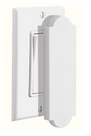 White magnetic Shabbos switch cover attached to a modern flat light switch.