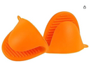 Two individual orange silicone pinch mitts, each with a textured, non-slip surface. One mitt is shown open, revealing the interior, while the other is upright. Both have small loops for hanging. 