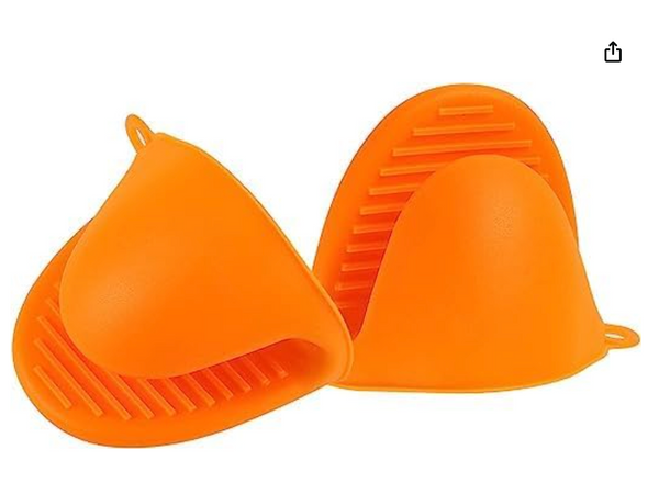 Two individual orange silicone pinch mitts, each with a textured, non-slip surface. One mitt is shown open, revealing the interior, while the other is upright. Both have small loops for hanging. They are displayed against a white background.