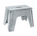 A light gray, plastic folding step stool with a hexagonal textured pattern on its surfaces, shown in an open position against a white background. The top surface has a rectangular handle cutout.