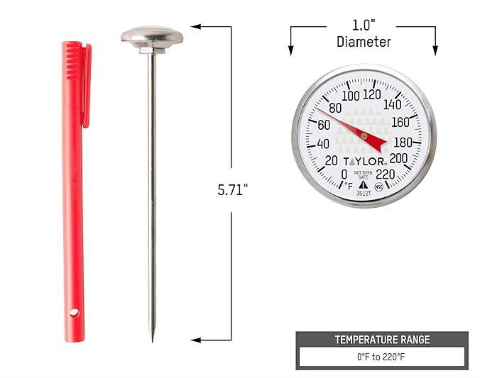 Taylor 1-inch dial analog meat thermometer with red pocket sleeve clip for grilling and cooking, displayed on a white background.