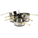 A stacked set of six small, shallow, hammered stainless steel mini frying pans with long, thin gold-colored handles.