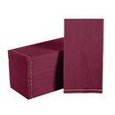A stack of cranberry red paper napkins with a subtle gold stripe detail on the border. The napkins are neatly folded and stacked.