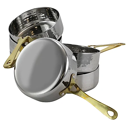 Set of six polished stainless steel mini frying pans with hammered finish, arranged on a white background.