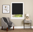 Black pleated window shade with a cordless, easy-to-install design, featuring a clear plastic clip for adjusting the length. The durable, light-blocking material provides privacy and room darkening, making it ideal for bedrooms, offices, and living spaces.