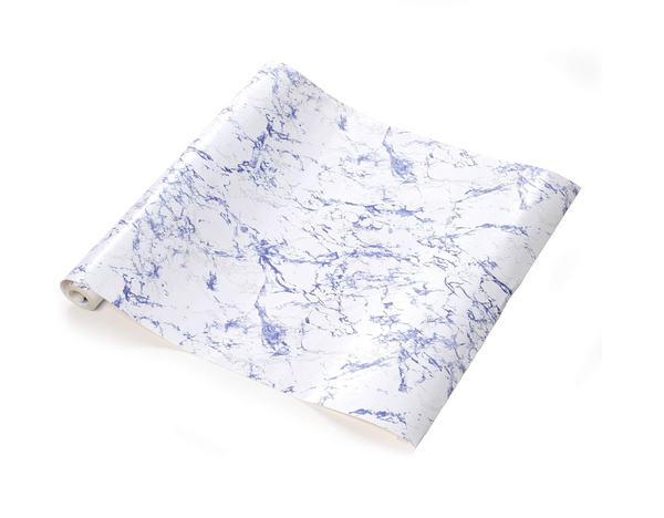 A roll of self-adhesive shelf and drawer liner, partially unrolled, displaying a white background with prominent blue and subtle grey marble-like veining.