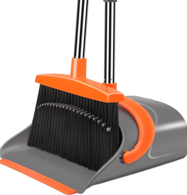 Grey and orange long-handled dustpan and brush set with black bristles, shown standing upright on a white background.