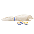 A set of four wavy, gold-toned napkin rings with a rich blue enamel finish.