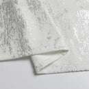 A folded 60" x 120" silver mosaic print tablecloth displayed on a white background.
