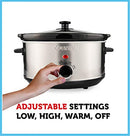 Stainless steel slow cooker with black lid and control dial.
