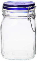 An empty, clear glass Bormioli Rocco Fido square-shaped jar with a vibrant blue lid insert and a metal wire clamp closure.