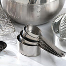 Set of four stainless steel oval measuring cups with stamped handles from Cuisipro, includes 1/4 to 1 cup sizes