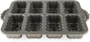 Nordic Ware silver holiday mini loaves pan with eight festive mold designs on a white background.