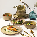 16-piece stoneware dinnerware set in Toast Cream with a reactive glaze finish, including dinner plates, salad plates, soup bowls, and all-purpose bowls.