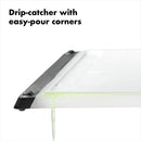 OXO Good Grips plastic carving and cutting board with drip-catcher groove and non-slip feet on a white background.