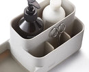 Joseph Joseph EasyStore bathroom caddy in ecru with divided compartments.