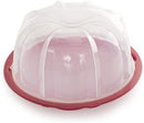 Clear plastic Bundt cake container with a red twist-lock lid, shown closed with a Bundt cake inside, displayed on a white background.