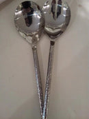 Silver hammered salad server spoon and fork set.